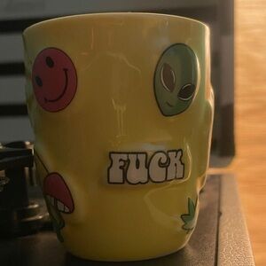 Vibrant Yellow Mug with Playful Graphics